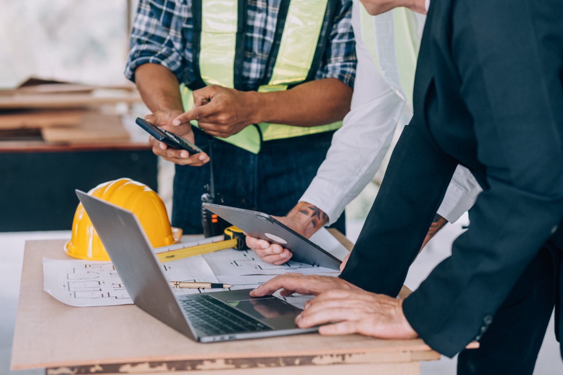 217579986_m_normal_none people discussing about a blue print on the new home construction